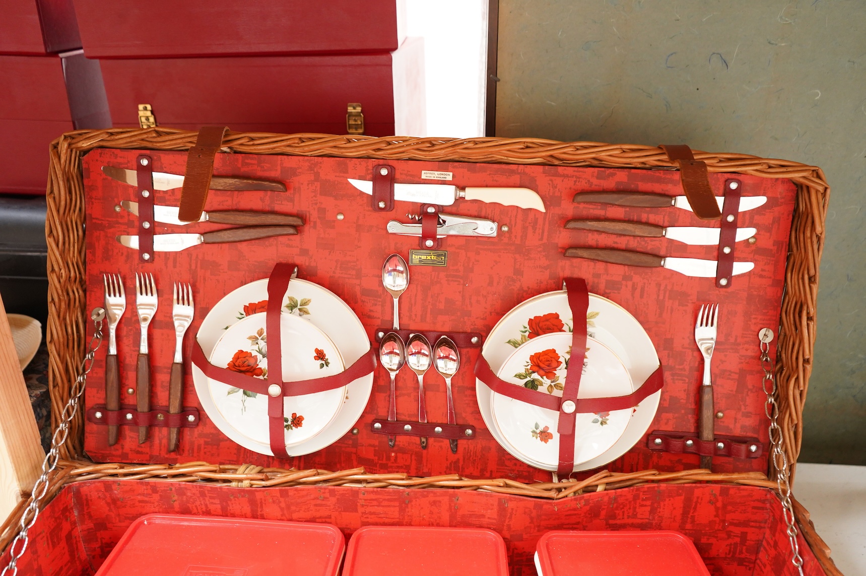 An Asprey wicker picnic basket, fully fitted with contents